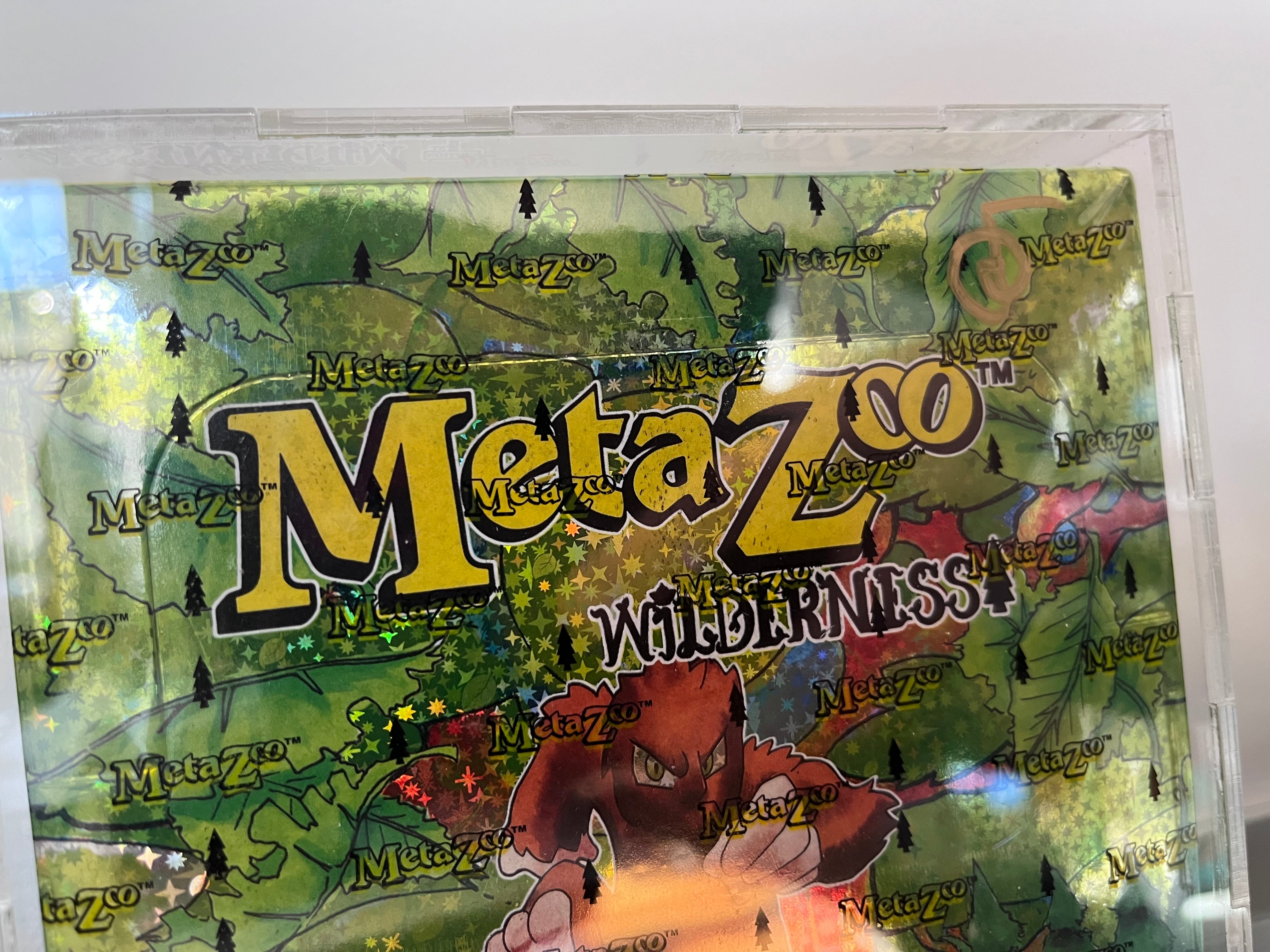 (SIGNED by Mike Waddell - Creator of MetaZoo) MetaZoo: 1st Edition Wilderness Booster Box - in Acrylic Case